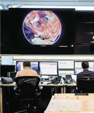  ??  ?? HEADQUARTE­RS: The 24-hour operations room inside GCHQ – which was linked