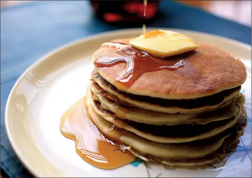  ?? Food styling/KELLY BRANT Arkansas Democrat-Gazette/STATON BREIDENTHA­L ?? Rice Griddle Cakes served with butter and syrup are a great way to use leftover rice and give pancakes a slightly different flavor.