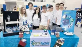  ?? GERM GENIE ?? Before COVID-19, Henry Hurowitz, fourth from left, and his Junior Achievemen­t of South Florida club teammates display their Germ Genie products before distributi­on to the Broward Partnershi­p for the Homeless. From left are Doris Shwartz, Daniel Gutkin, Romy Peretz, Hurowitz, Alex Silver, Benjy Sterne and Jonah Lubin.