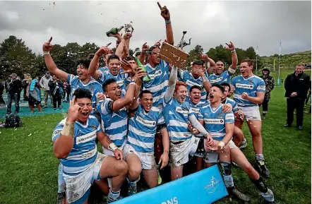  ?? PHOTO: CAMERON BURNELL/STUFF ?? St Patrick’s College, Silverstre­am celebrate their win over Wellington College on Sunday.