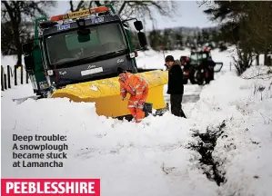  ??  ?? Deep trouble: A snowplough became stuck at Lamancha
PEEBLESSHI­RE