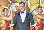  ?? AFP ?? Stephen Colbert dances with “handmaids.”