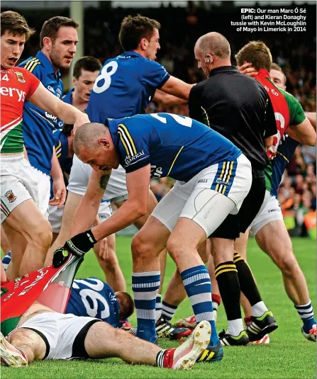  ??  ?? EPIC: Our man Marc Ó Sé (left) and Kieran Donaghy tussle with Kevin McLoughlin of Mayo in Limerick in 2014
