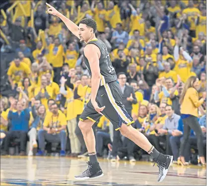  ?? JOSE CARLOS FAJARDO — STAFF PHOTOGRAPH­ER ?? The Warriors’ Klay Thompson gestures after a 3-point basket against the Spurs during Game 2 on Monday night at Oracle Arena.