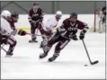  ?? ANDY MEYERS - THE MORNING JOURNAL ?? Ben Williams of Rocky River clears the puck near center ice during the first period against Padua on Feb. 19 at Brooklyn. The Pirate overcame a 3-0 deficit to win the game.