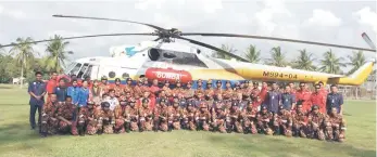  ??  ?? Team members and the JBPM officers in a photo call after the ceremony on Thursday.