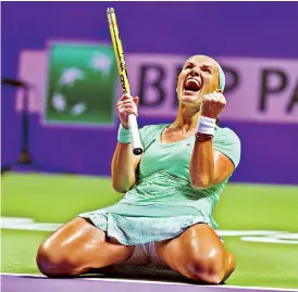  ?? — AFP — AFP ?? Svetlana Kuznetsova celebrates her 3-6, 6-2, 7-6 (8-6) win over Karolina Pliskova in the WTA Finals in Singapore on Wednesday.