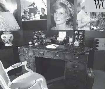  ?? KIRSTY WIGGLESWOR­TH / THE ASSOCIATED PRESS ?? A display to mark the 20th anniversar­y of the death of Princess Diana includes the desk she used at Kensington Palace to pen both official business and notes expressing her emotional turmoil after the collapse of her marriage