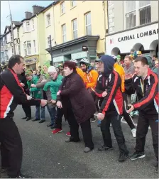  ??  ?? Members of the Mallow Cope Foundation entertaini­ng at the Parade on Sunday