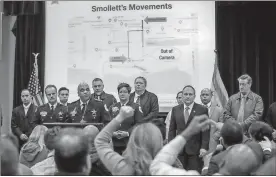  ?? / Ashlee Rezin/Chicago Sun-Times via AP ?? Chicago Police Supt. Eddie Johnson (fourth from left) answers questions after actor Jussie Smollett turned himself in on charges of filing a false police report.