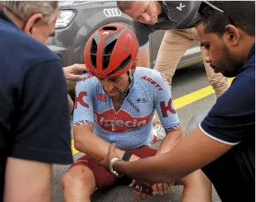  ??  ?? The race doctors tend to Alex after he crashes out of the UAE Tour with a fractured thumb