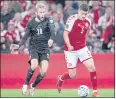  ?? LISELOTTE SABROE — THE ASSOCIATED PRESS ?? Denmark’s Joakim Maehle, right, and Austria’s Konrad Laimer battle for the ball during the World Cup Group F qualifying soccer match Tuesday.