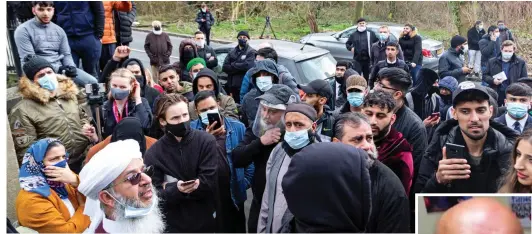  ??  ?? Protest: Angry crowds of parents gather outside Batley Grammar School yesterday