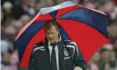  ??  ?? McClaren shelters from the Wembley rain during England’s defeat to Croatia in 2007. Photograph: Tom Jenkins/The Guardian