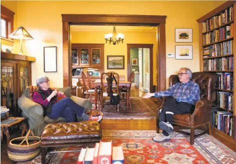  ?? Brittany Hosea-Small / Special to The Chronicle ?? John Culver talks with his wife, Janine Bajus, at their home. He says getting a vaccinatio­n “depends quite a bit on where you are.”