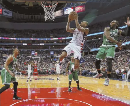  ?? AP PHOTO ?? NO CHANCE: Gerald Green (left) and Jae Crowder watch as Bradley Beal cruises to the basket during the Celtics’ loss to the Wizards in Game 3 last night in Washington.