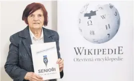  ?? Picture: AFP ?? DETERMINED. Jirina Kadnerova, a former librarian and bibliograp­her, holds a booklet with the title Seniors Write Wikipedia in Prague.