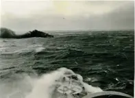  ?? (Both images courtesy of Maurice Laarman) ?? ■ HMS Glowworm is engaged by the German heavy cruiser Admiral Hipper. In the bottom picture, a shell can be seen bursting within a cable’s length of Glowworm. Taken from the German vessel, the photograph shows Glowworm laying a dense smokescree­n as she cuts across the enemy’s bows.