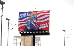  ?? — AFP ?? A billboard by US artist Mitch O’Connell depicting US president Donald Trump is displayed, in allusion and as a tribute to John Carpenter’s 1988 cult movie ‘They Live’, in Naucalpan de Juarez, state of Mexico.