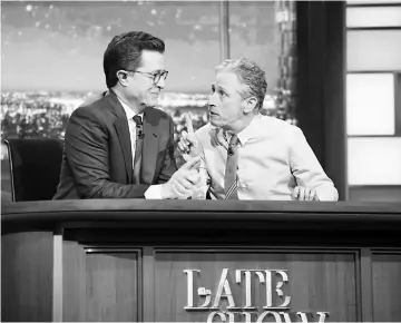  ??  ?? Colbert (left) and Stewart reunite on CBS’ ‘The Late Show’ on Monday. — Photo courtesy of CBS