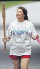  ?? BITA HONARVAR / AJC ?? Jerri Peterson of Roswell had the Olympic spirit in 2012 as she practiced her torch run for London’s Games.