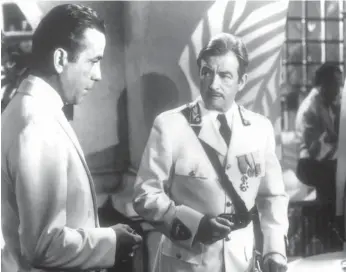  ?? WARNER BROS. ?? Humphrey Bogart, left, and Claude Rains in a scene from the classic film Casablanca.