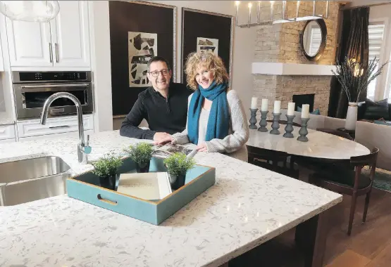  ?? CHRISTINA RYAN ?? Laurie McBain and Scott Alkenbrack fell in love with the bright and airy floor plan in their new executive paired home in Mahogany.