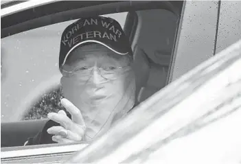  ?? JOE CAVARETTA/SOUTH FLORIDA SUN SENTINEL ?? A man drives up to a COVID-19 testing site Monday at the South County Civic Center in Delray Beach.