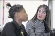  ??  ?? McQueen, talking with Lester Prep seventh-grader Messiaya Baldwin, 12, said she is concerned about perception­s of ASD as taking something from the community, rather than adding to it.