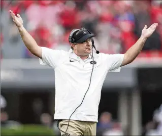  ?? PHOTOS BY JASON GETZ/JASON.GETZ@AJC.COM ?? With a victory, Georgia head coach Kirby Smart could become the coach with the most wins in his first 100 games at the same SEC school in conference football history.