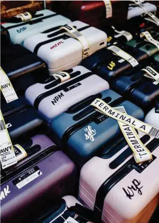  ?? PICTURE CREDIT: NINA WESTERVELT/NYT ?? Away’s cultish hard-shell rolling suitcases in signature colours.