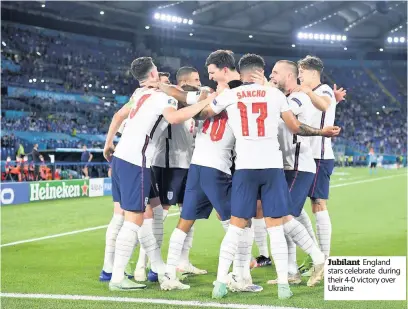  ??  ?? Jubilant England stars celebrate during their 4-0 victory over Ukraine