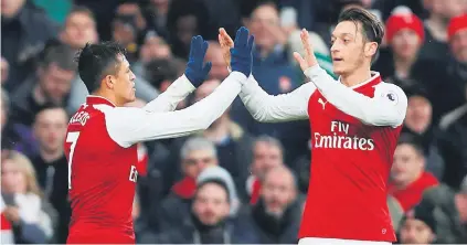  ?? Picture: Reuters ?? ICING ON THE CAKE. Arsenal’s Alexis Sanchez celebrates after scoring their second goal with team-mate Mesut Oezil in their English Premier League match against Spurs at the Emirates on Saturday.