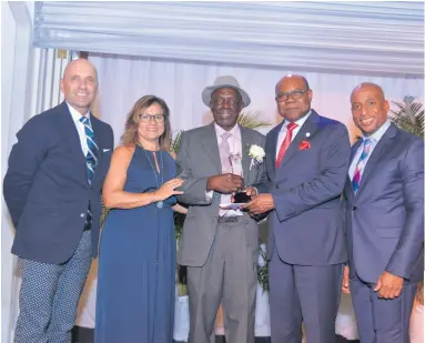  ??  ?? From left: Josef Forstmayr, JP, OD, Patricia Alfonso-Dass, Daniel McIntyre, Tourism Minister Edmund Bartlett, and Omar Robinson.