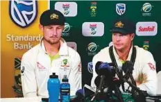  ?? AFP ?? Australia captain Steve Smith ( right) and Cameron Bancroft admitting to ball tampering in Cape Town on March 24.