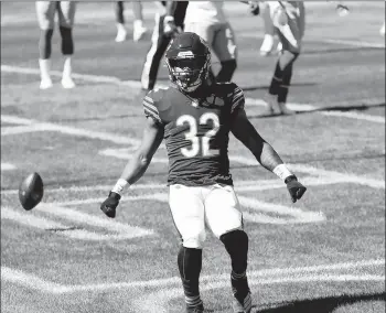  ?? JOHN J. KIM/CHICAGO TRIBUNE ?? Running back David Montgomery celebrates after scoring a touchdown for the Bears on Sunday against the Giants.