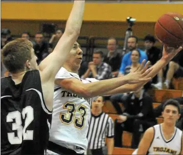  ?? GENE WALSH — DIGITAL FIRST MEDIA ?? Wissahicko­n’s Carmen Ostroski drives to the hoop as Strath Haven’s Cooper Driscoll defends in District playoffs February 21, 2018.