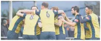  ?? PICTURES Martyn White ?? GREAT START Moneyfield­s celebrate their first-minute goal. Above - goalscorer Steve Hutchings battles for possession against Truro City