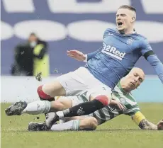  ??  ?? 0 Ryan Kent feels the pain of a Scott Brown challenge