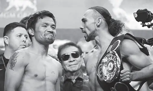  ??  ?? MANNY Pacquiao (left) and Keith Thurman face off after weighing in ahead of their WBA welterweig­ht world title boxing fight at MGM Grand Garden Arena. Joe Camporeale, USA TODAY Sports via Reuters