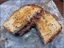  ?? (Arkansas Democrat-Gazette/Eric E. Harrison) ?? Our Reuben from Slick’s was sloppy but delicious.