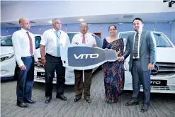  ??  ?? From left: Business Unit Manager – Mercedes-benz Commercial Vehicle Sales Shamal Fernando, Group CEO of DIMO Gahanath Pandithage, Chairman and Managing Director of DIMO Ranjith Pandithage ceremoniou­sly handing over the Mercedes–benz Vito vans to...