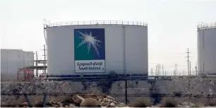  ?? Reuters ?? Oil tanks seen at the Saudi Aramco headquarte­rs. The Organisati­on of the Petroleum Exporting Countries and other producers outside the group agreed in November to cut output by about 1.8 million barrels per day (bpd) in an effort to drain a glut that...