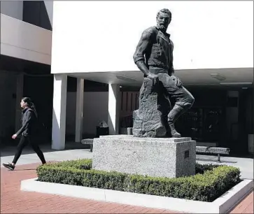  ?? Luis Sinco Los Angeles Times ?? THE STATUE, formally named “The Forty-Niner Man,” will be moved to a future Cal State Long Beach alumni center. To some students, it symbolizes the killing of indigenous people during the 1800s gold rush.