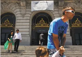  ?? Tim Hussin / Special to The Chronicle 2014 ?? A banner hangs at City Hall in 2014 asking George Lucas to build his museum here. Ed Lee lobbied the “Star Wars” creator anew, but Lucas chose L.A.