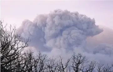  ??  ?? A plume of smoke is seen from Ojai, California as the Thomas Fire grows and advances toward seaside communitie­s near Carpinteri­a. — Reuters photo