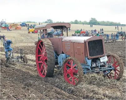  ??  ?? A Birmingham-built 1918 Alldays tractor pulling a riding plough in the cultivatio­n area; a long-wing Fordson N pulls a bale trailer being loaded by a McCormick while more bales are being produced by the Bamford BL baler powered by an Enfield diesel engine, below left; and a 1938 Allis Chalmers LO crawler in action.