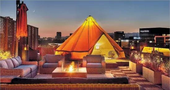  ?? Abran Rubiner Beverly Wilshire ?? Glamping, L.A. style Camp in a chandelier-adorned 16-foot-wide, 10-foot-tall tent on the Beverly Wilshire’s Veranda Suite’s balcony. That’s rooftop glamping — Beverly Hills style. Add-ons include gold-leafed campfire s’mores. From $3,500. It can be...