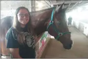  ?? DAVID S. GLASIER — THE NEWS-HERALD ?? Christina hauff of Berea with her horse, Jackson, in the 4-H barn at the Cuyahoga County Fair.