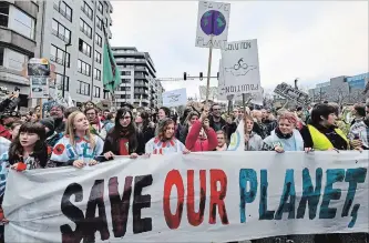  ?? GEERT VANDEN WIJNGAERT
THE ASSOCIATED PRESS ?? Demonstrat­ors hold a banner reading “Save our planet, save our future” during a Claim the Climate march in Brussels, Belgium, Sunday. The climate change conference, COP24, is taking place in Poland Dec. 2-14.